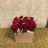 Type of Flowers: Red Roses and filler in a handmade, reusable, wooden