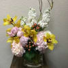 Enjoy this sunset-designed arrangement with warm colors and branches. Type of Flowers: