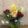 Type of Flowers: Yellow Cymbidium Orchids, King Protea, Red Roses, White Parrot
