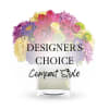 Compact mixed bouquet in a clear square vase