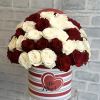 Red and white roses in a striped heart box with "Be Mine" text