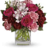 Pink and red bouquet in a clear glass vase