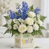 Tall blue delphinium spikes give this New Baby blue and white arrangement