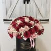 Romance in Bloom&rdquo; Rose Hatbox Arrangement

The &ldquo;Romance in Bloom&rdquo; arrangement is a