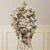 Pink and white floral standing spray with ribbon streamers