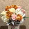 Type of Flowers: Cymbidium Orchid, Hydrangeas, Roses and Dusty Miller in a