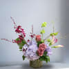 Enjoy this Japanese inspired, simple and modern piece with Orchids, Calla Lilies