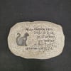 Decorative stone plaque with a cat silhouette and memorial text