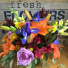 Colorful mixed bouquet with lilies, iris, roses, and snapdragons