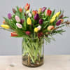 Brighten up someone's day with these vibrant tulips! Crafted with care in