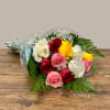 Bouquet of multicolored roses with baby's breath and fern foliage