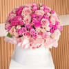 Large bouquet of pink and blush roses in a white hat box