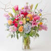 Enjoy the enchantment of bright, lush blooms with our "Wild Beauty" arrangement.