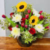 Bright yellow sunflowers take center stage in this mixed-color bouquet, paired with