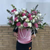 Pink roses, with a hint of lisianthus in a plush pink box