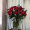 Bouquet of red roses in a clear glass vase