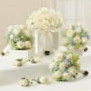 White rose bouquets with pale blue hydrangeas and matching boutonnieres