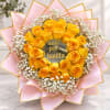 Yellow roses with white baby's breath wrapped in pink paper
