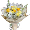Yellow roses and white carnations in a wrapped bouquet