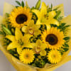 Yellow bouquet with sunflowers, lilies, and orchids wrapped in yellow paper