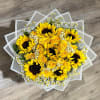 Bouquet of yellow sunflowers and roses with small white daisies