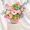 Pink and blue mixed bouquet in a round vase