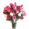 Bouquet of pink and red roses in a clear glass vase