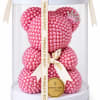 Pink pearl teddy bear in a clear gift box with a ribbon