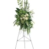 Tall white rose and greenery standing spray on an easel