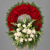 Large red and white rose wreath on a wooden easel