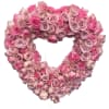 Heart-shaped wreath of pink roses on a white background