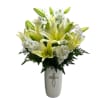 Tall Ceramic ivory vase with silver cross filled with white lilies and