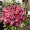 Bouquet of pink and lavender roses with fern filler