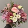 Handheld bouquet of pink and white flowers with lavender blooms