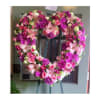 Heart-shaped floral wreath with pink and purple flowers