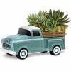 Succulent arrangement in a turquoise pickup truck planter