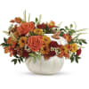 Autumn floral arrangement in a white pumpkin vase