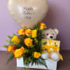 Yellow roses with a heart-shaped Father’s Day balloon and teddy bear gift box