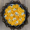 Yellow roses with baby breath and black paper. This arrangement also includes