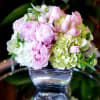 Peony's in a beautiful silver vase, enjoy this mixture of hydrangeas and