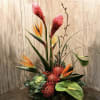 Tall tropical arrangement with bird of paradise, red protea, and anthurium