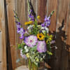This beautifully arranged bouquet will include both tall elegant flowers and shorter