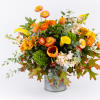 Autumn bouquet of orange and yellow flowers in a metal container