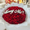 Large bouquet of red roses with white "Marry Me!" lettering