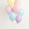 Cluster of pastel balloons in yellow, pink, blue, and lavender