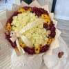An elegant arrangement of cream-colored roses surrounded by a crown of deep