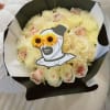 "This exclusive bouquet blends the elegance of white roses with the mysterious
