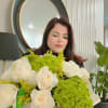 White roses and green hydrangeas in a box bouquet