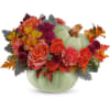 Fall floral arrangement in a pale green pumpkin vase