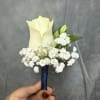 White rose boutonni&egrave;re with baby breath wrapped with navy ribbon 